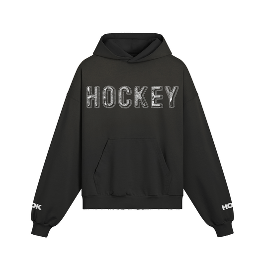 Oversize fit black hoodie with "Hockey" text, sleeve print, and washed effect, made of 100% cotton.